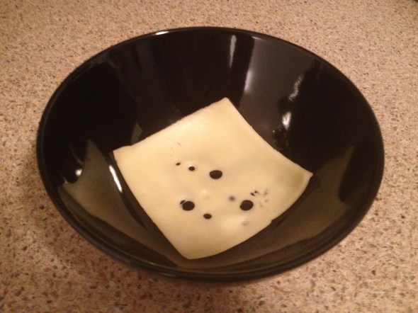 We're going to put a layer of cheese on the bottom of the soup to get that famous cheesiness. 